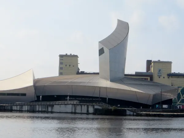 Imperial War Museum North on Trafford Wharf Road, Trafford Park, seen across the Manchester Ship Canal