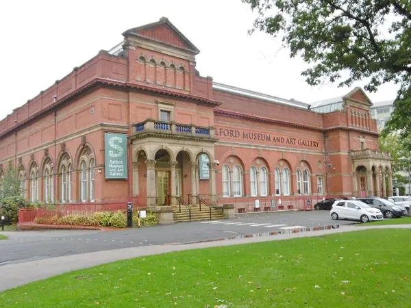 Red-brick Salford Museum and Art Gallery building on The Crescent beside Peel Park