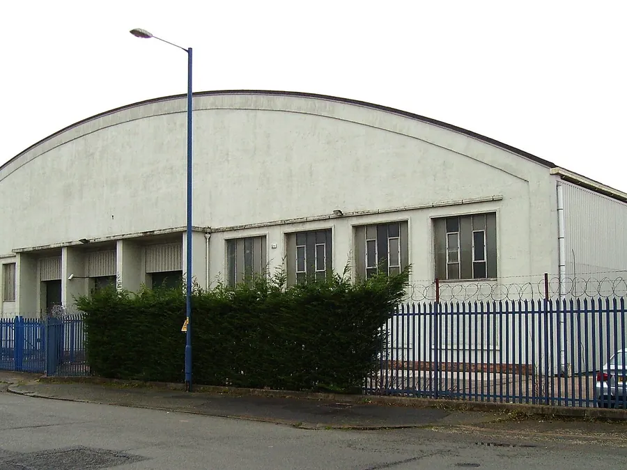 Large curved-roof former bus garage on Bradnor Road in the Sharston industrial area, Wythenshawe